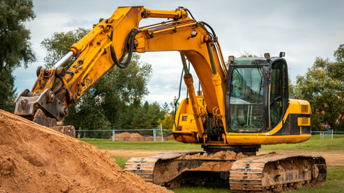 Excavator shoveling dirt